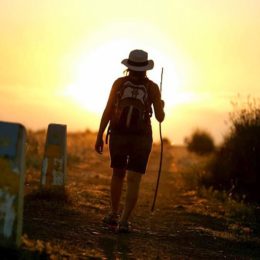 walking alone into the sunset with the arrow on the marker