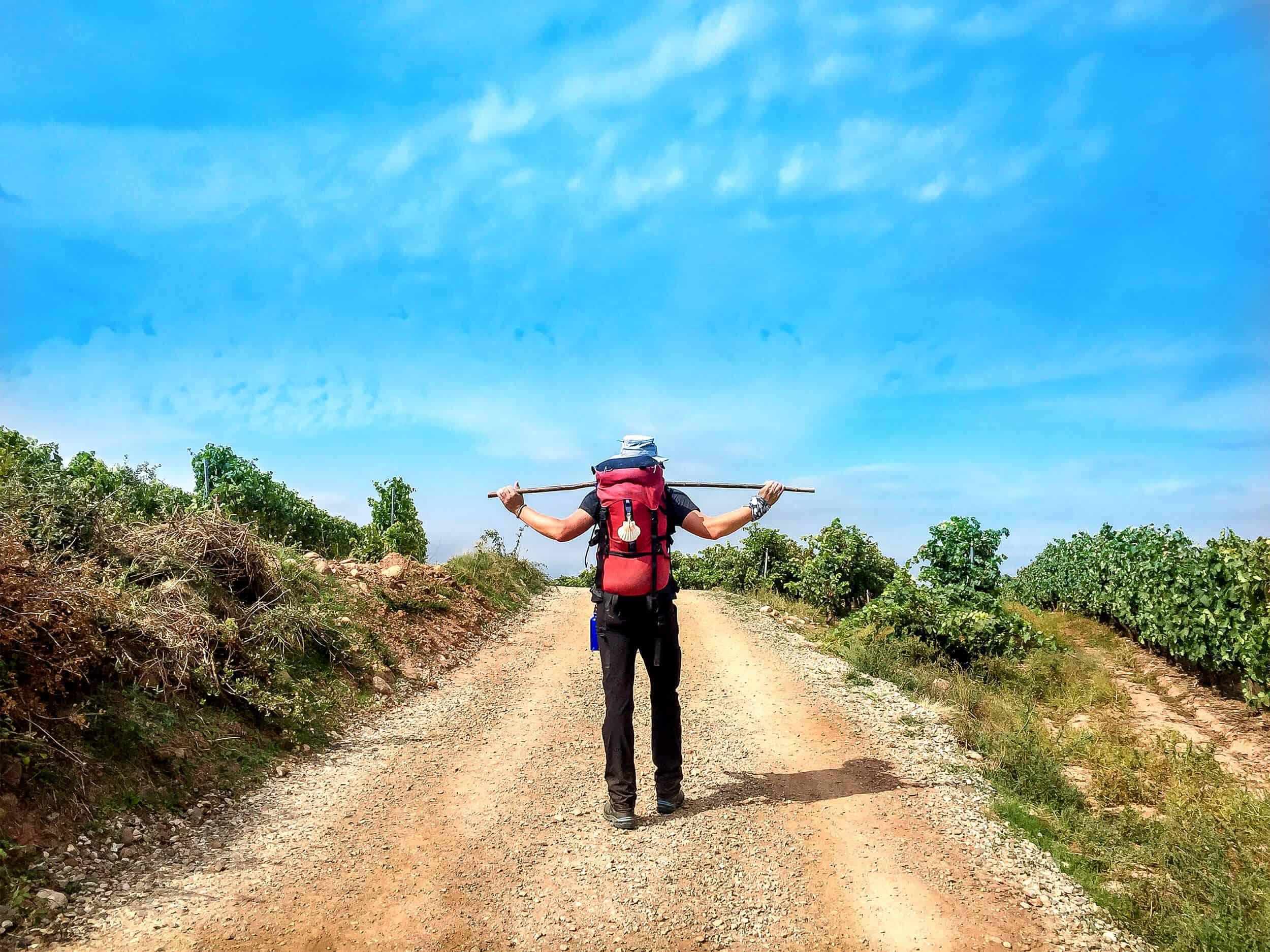A man stretching on the Camino route in Spain