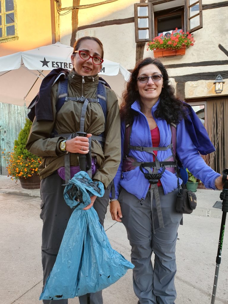 the team walking the camino picking up plastic